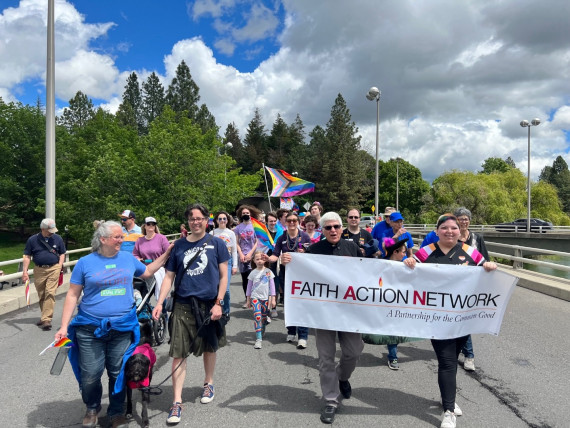 FAN members holding banner and marching in Spokane Pride parade in 2022